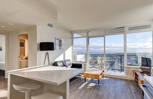 Metrotown Apartment | Executive 1BR + Den with Panoramic Balcony, Pool & Gym in Metrotown