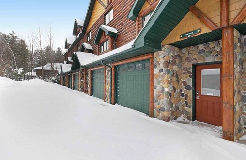 Eagle River Condo | Waterfront townhome with fireplace, private patio, & shared boat docks