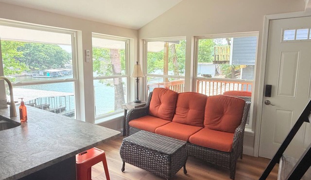 Cozy 740 sq ft A-frame cabin at North Shore Resort with lake views, 1 bedroom + loft (sleeps 6), full kitchen, island seating, and a private deck—perfect for relaxing getaways at Lake of the Ozarks. in Eldon