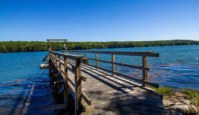 Private waterfront home with large deck & deep water dock in Georgetown