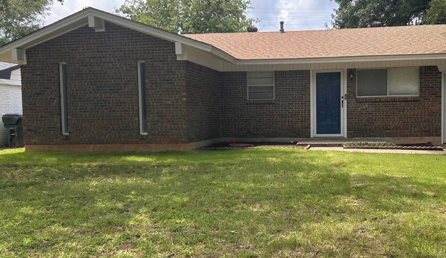 The Second House with a Blue Door sleeps up to 8 in Norman