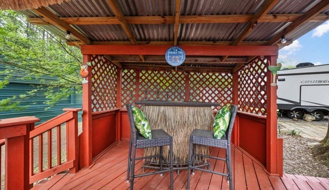 THIS IS AN AWESOME 36' RENTAL CAMPER WITH AMAZING LONG DECK, PLUS A SECOND STEP-DOWN DECK TO YOUR OWN PRIVATE HIDEAWAY TIKI BAR! A BEAUTIFUL HUGE LIVE OAK COVERS THE ENTIRE LOT SO IT'S ALWAYS SHADED, AND THIS EVEN COMES WITH A TABLE & CHAIRS FOR OUT in Pace