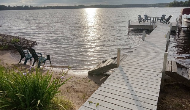 Water front cabin with sandy beach, sandy swim area. No stairs to lake. in Webster