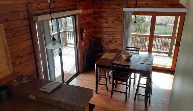 Log Cabin,dock,boat slip, fire pit , and walk to Bagnell in Lake Ozark