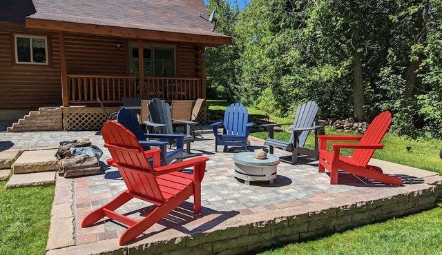 Log Cabin home on the Sturgeon River in Indian River in Indian River