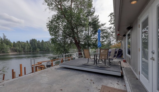 Spacious waterfront home with hot tub, large decks, kayaks, and beach access in Gig Harbor